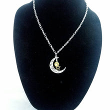 Brass Bullet Shell with star charm on a silver moon pendant