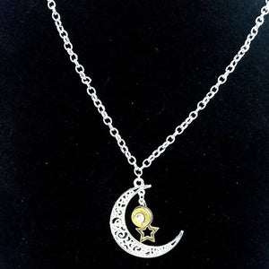 Brass Bullet Shell with star charm on a silver moon pendant